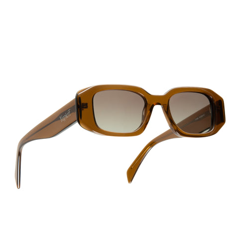 A pair of rectangular-framed sunglasses with translucent amber brown frames and gradient brown lenses, shown from a side angle on a plain white background.