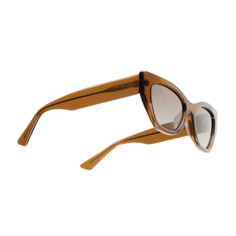 A pair of cat-eye sunglasses with translucent amber brown frames and gradient brown lenses, shown from a three-quarters angle on a solid white background.